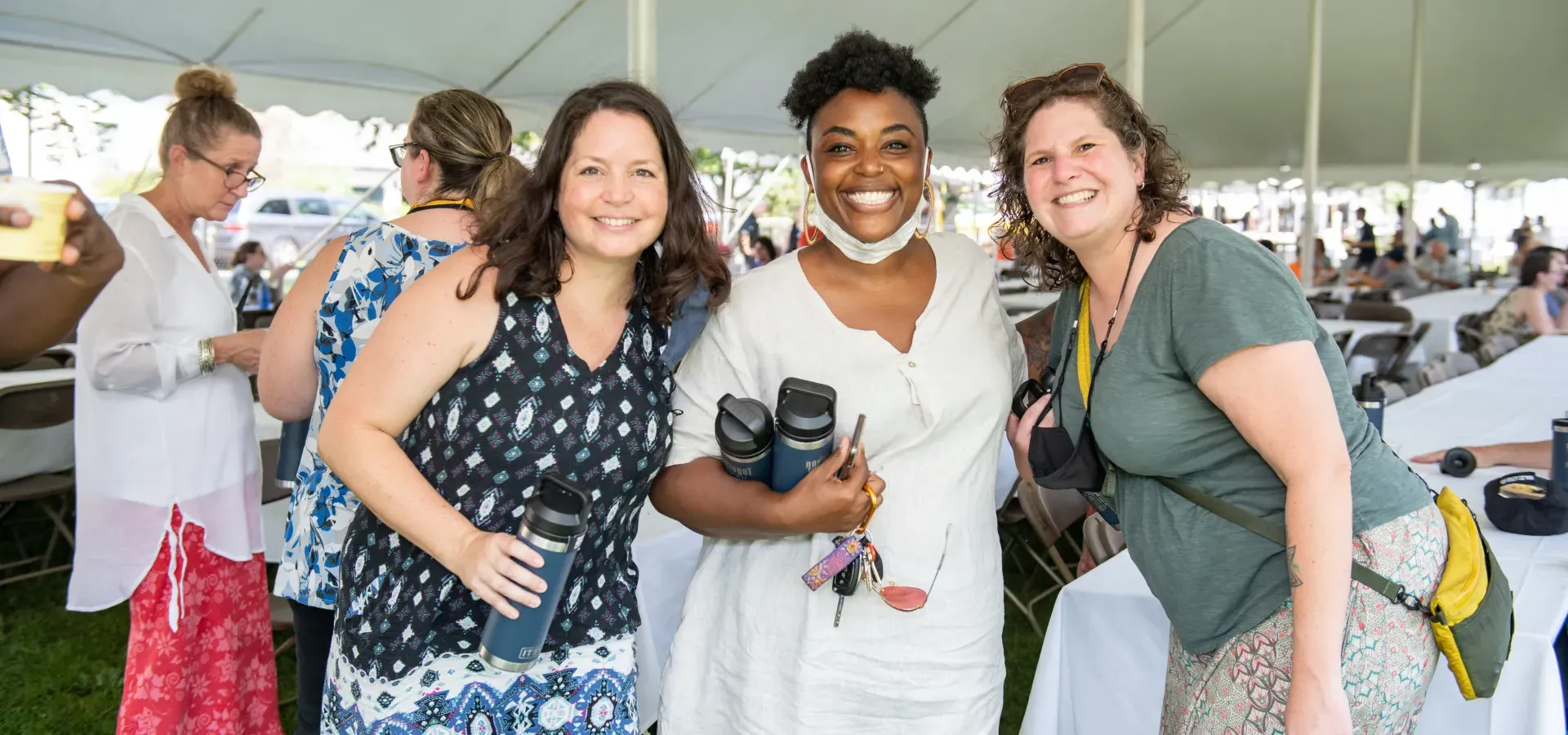 Three staff members at an employee picnic.